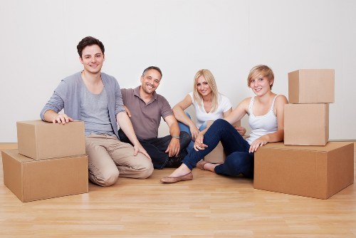 Removal specialists handling household items with care during relocation